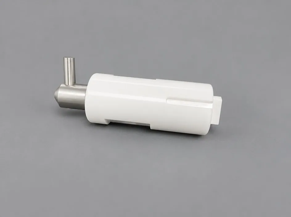 A white cylindrical sleeve over a machined metal core, with a short metal side pin projecting near the closed end.