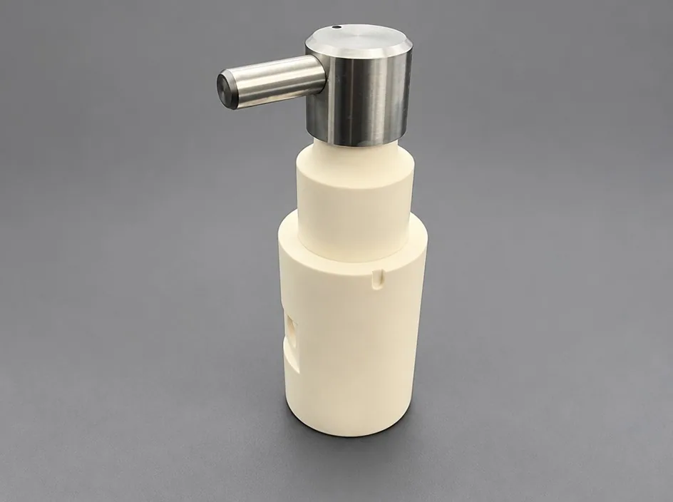A white stepped body on a grey studio ground with a machined metal head at the top and a short side pin.