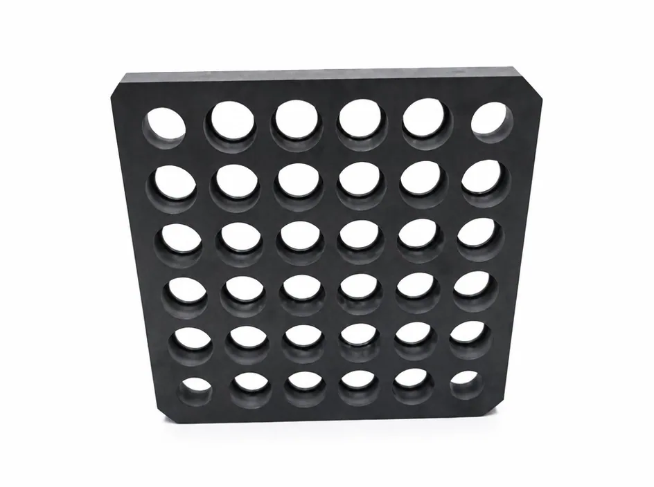A square silicon nitride plate on a white ground, drilled with a grid of thirty-six holes.
