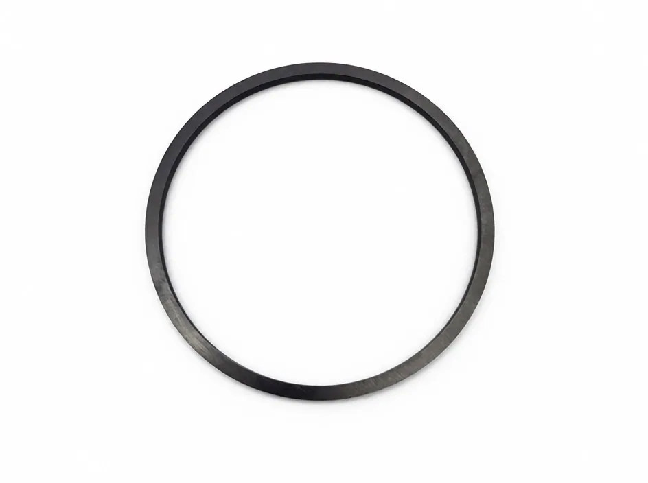 A thin silicon nitride ring photographed flat on a white ground.