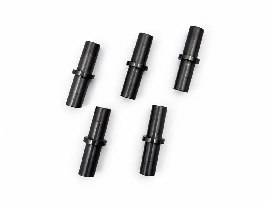 Five silicon nitride pins on a white ground, each turned with a central flange and shoulders at both ends.