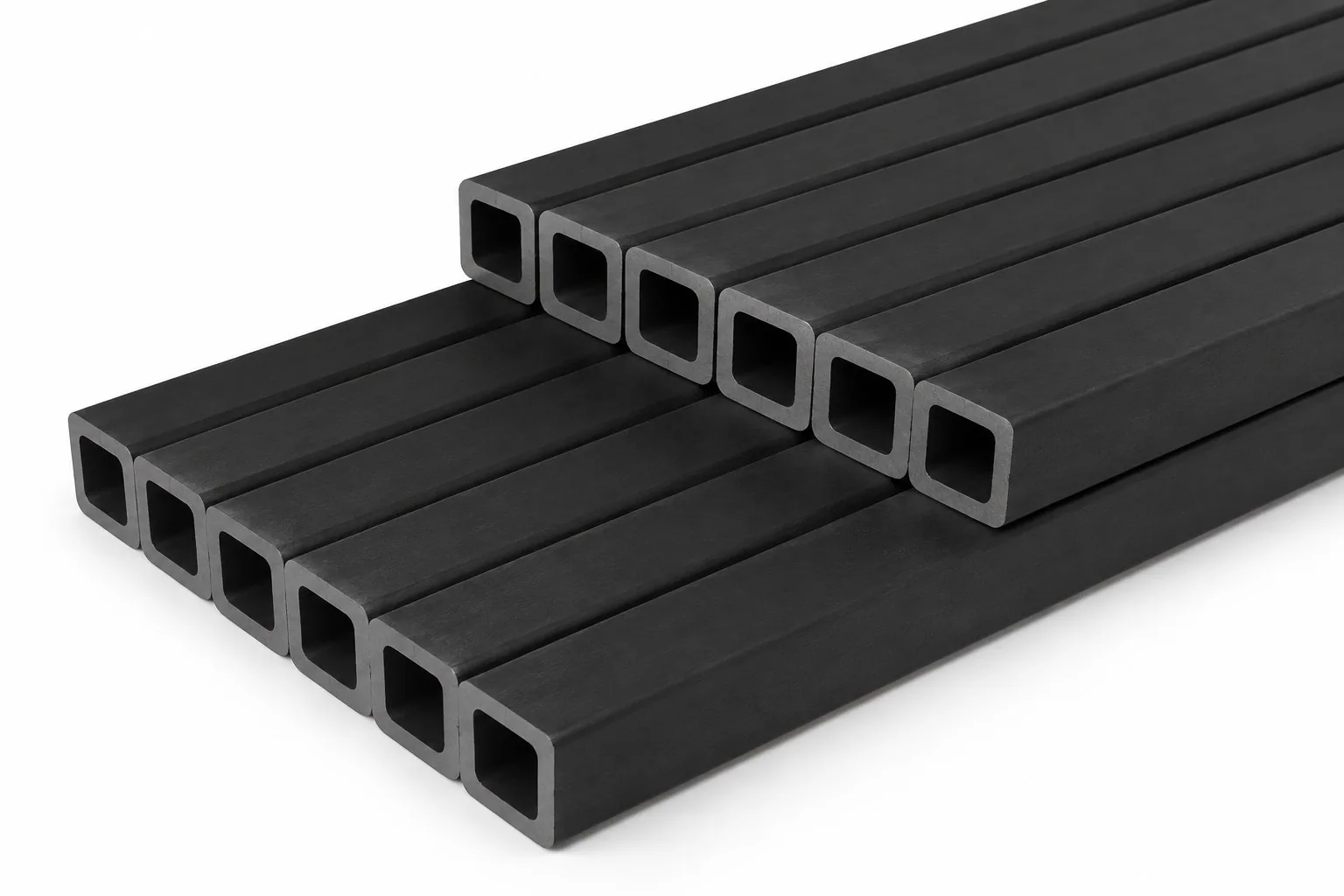 Eleven black silicon carbide beams with a square hollow section on a white ground, arranged in two rows with the open ends facing the camera.