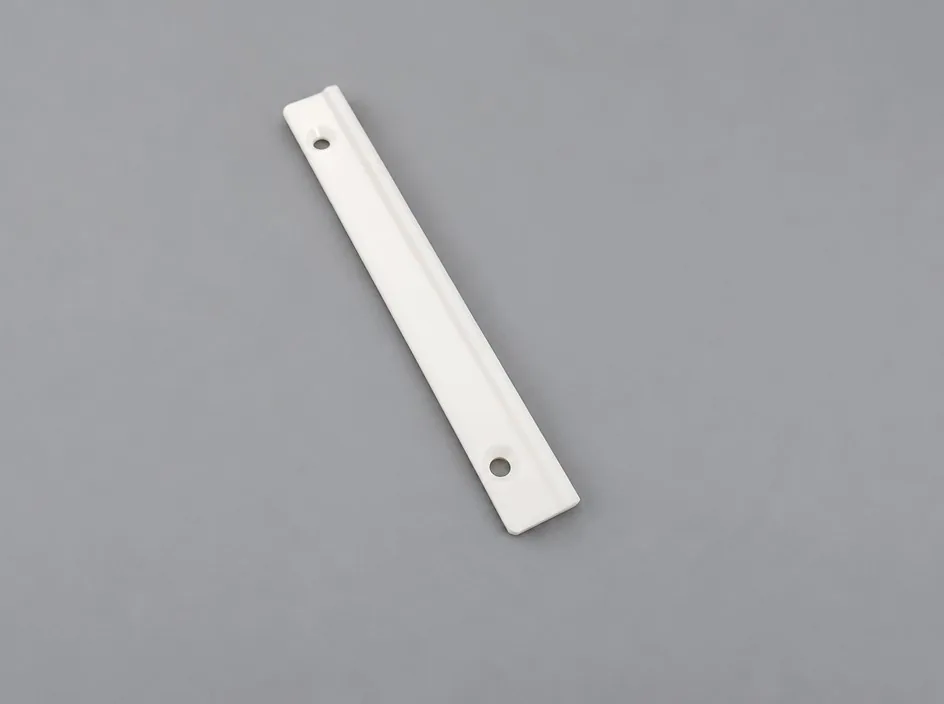 A single thin zirconia bar on a grey studio ground, with a lengthwise groove and two holes near the ends.
